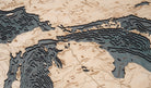 Great Lakes 3D layered wood map in laser-cut Baltic birch, shown framed against a light wall