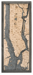 Manhattan, New York 3D layered wood map in laser-cut Baltic birch, shown framed against a light wall