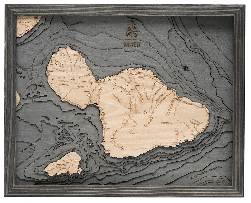 Maui, Hawaii 3D layered wood map in laser-cut Baltic birch, shown framed against a light wall