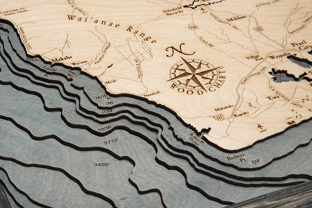 Maui, Hawaii 3D layered wood map in laser-cut Baltic birch, shown framed against a light wall