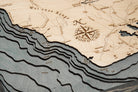 Maui, Hawaii 3D layered wood map in laser-cut Baltic birch, shown framed against a light wall