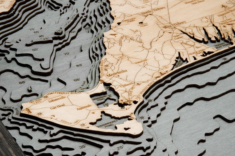 Martha's Vineyard, Massachusetts 3D layered wood map in laser-cut Baltic birch, shown framed against a light wall