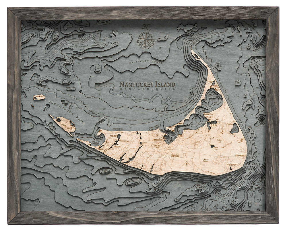 Nantucket, Massachusetts 3D layered wood map in laser-cut Baltic birch, shown framed against a light wall