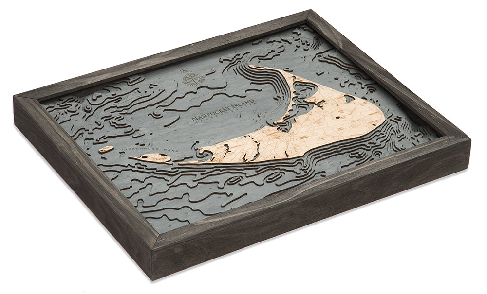 Nantucket, Massachusetts 3D layered wood map in laser-cut Baltic birch, shown framed against a light wall