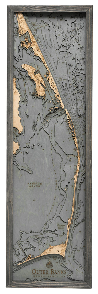 Outer Banks, North Carolina 3D layered wood map in laser-cut Baltic birch, shown framed against a light wall