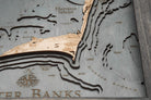 Outer Banks, North Carolina 3D layered wood map in laser-cut Baltic birch, shown framed against a light wall