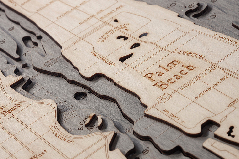Palm Beach, Florida 3D layered wood map in laser-cut Baltic birch, shown framed against a light wall
