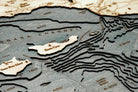 Santa Barbara, California 3D layered wood map in laser-cut Baltic birch, shown framed against a light wall