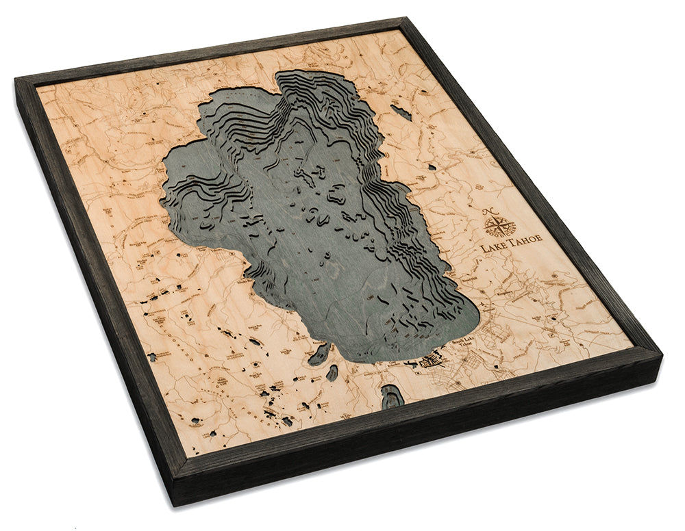 Lake Tahoe, California 3D layered wood map in laser-cut Baltic birch, shown framed against a light wall