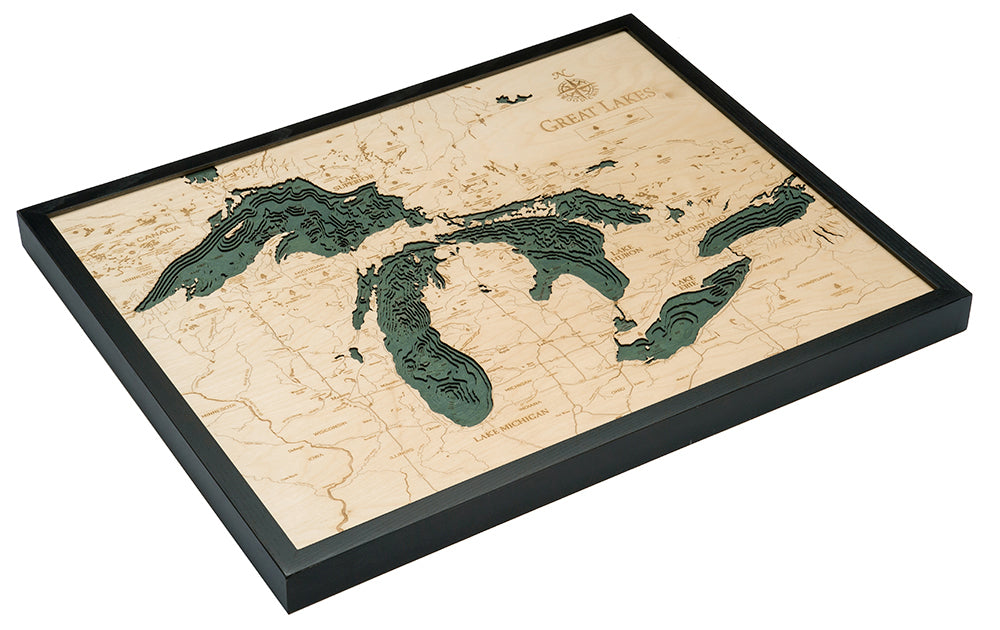 Great Lakes 3D layered wood map in laser-cut Baltic birch, shown framed against a light wall