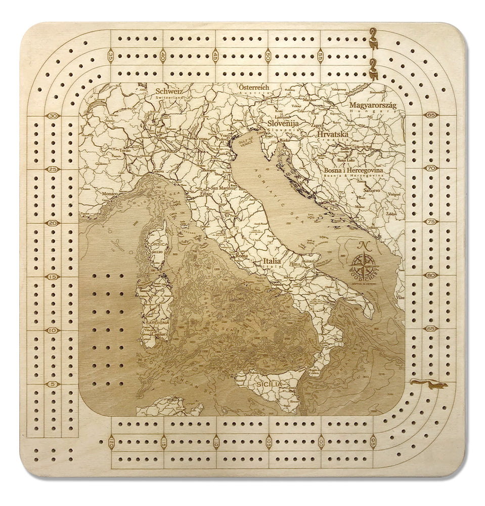 Italy wood cribbage board in laser-cut Baltic birch, shown framed against a light wall