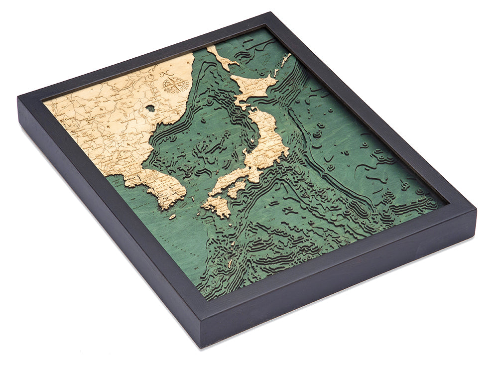 Japan 3D layered wood map in laser-cut Baltic birch, shown framed against a light wall