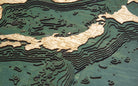 Japan 3D layered wood map in laser-cut Baltic birch, shown framed against a light wall