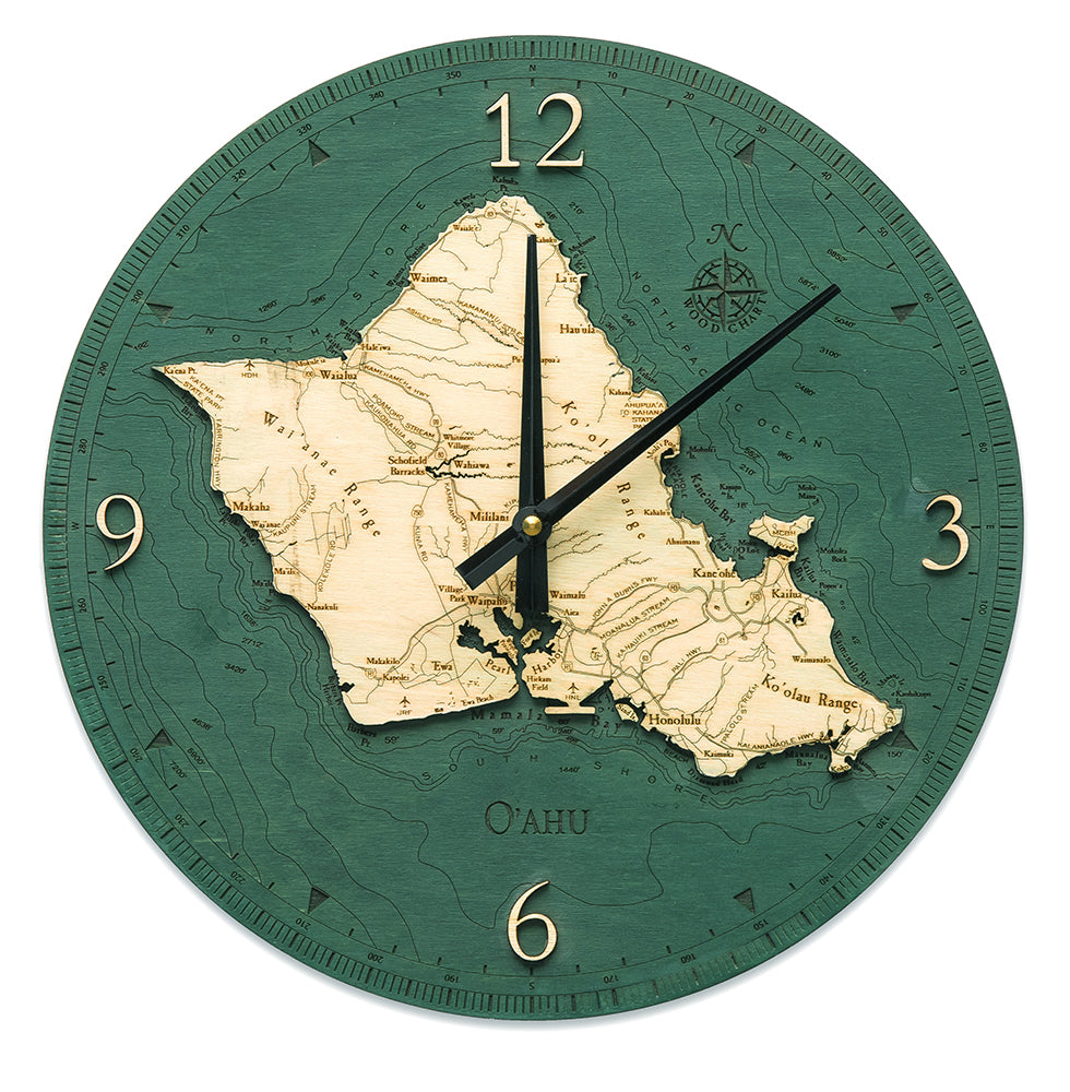Oahu, Hawaii wood wall clock in laser-cut Baltic birch, shown framed against a light wall