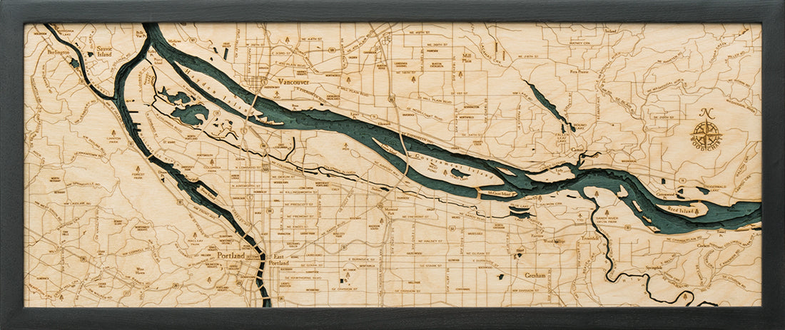 Portland, Oregon 3D layered wood map in laser-cut Baltic birch, shown framed against a light wall