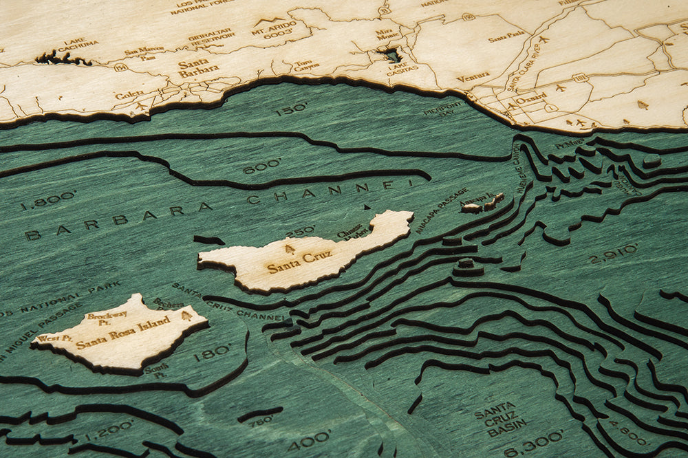Santa Barbara, California 3D layered wood map in laser-cut Baltic birch, shown framed against a light wall