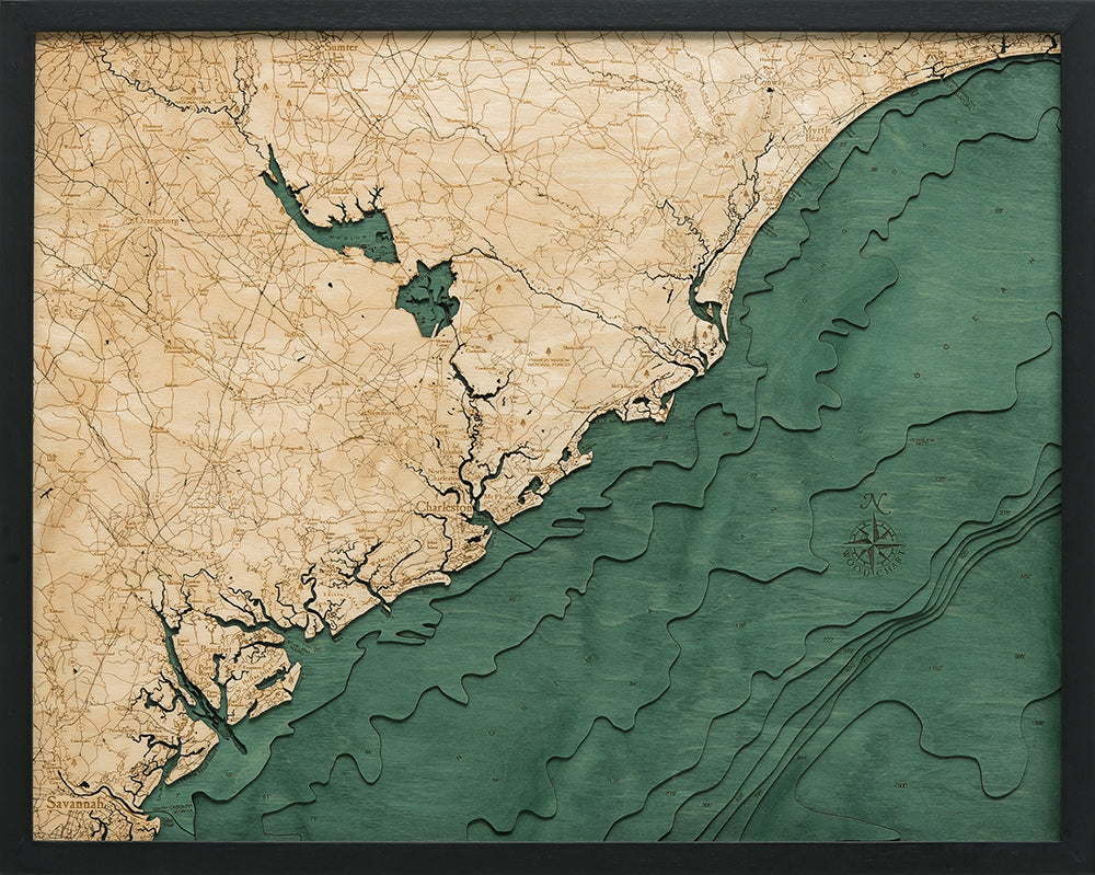 South Carolina Coast 3D layered wood map in laser-cut Baltic birch, shown framed against a light wall