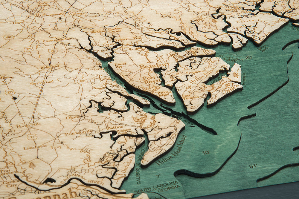 South Carolina Coast 3D layered wood map in laser-cut Baltic birch, shown framed against a light wall