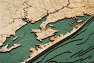 Virginia Beach to Kitty Hawk 3D layered wood map in laser-cut Baltic birch, shown framed against a light wall