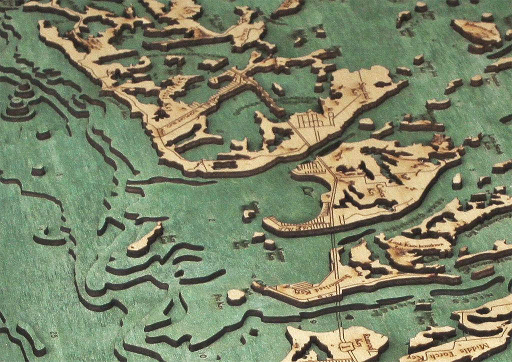 Florida Keys 3D layered wood map in laser-cut Baltic birch, shown framed against a light wall