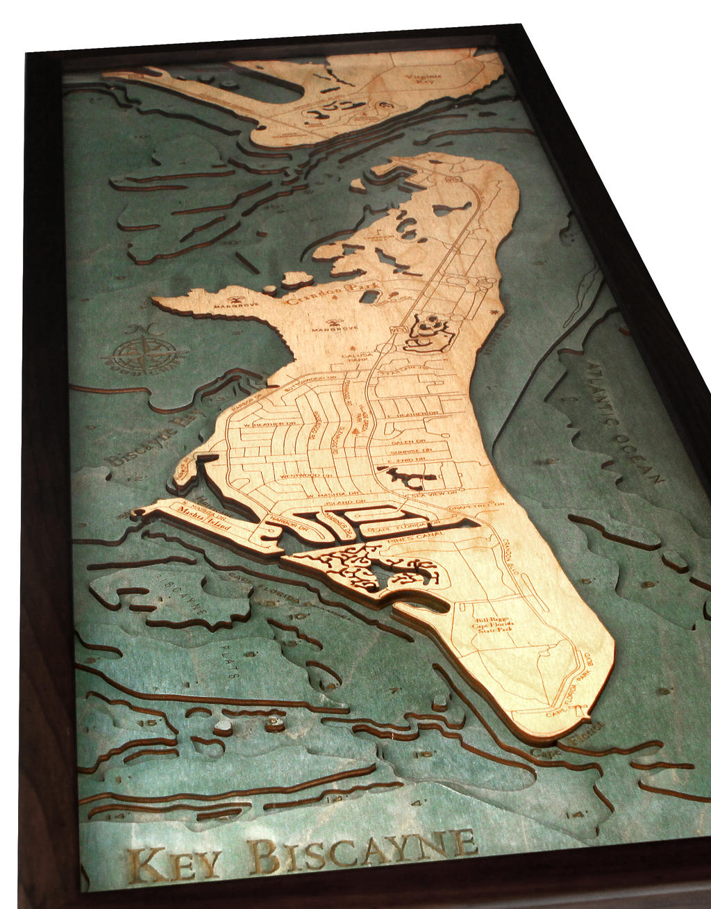 Key Biscayne, Florida 3D layered wood map in laser-cut Baltic birch, shown framed against a light wall