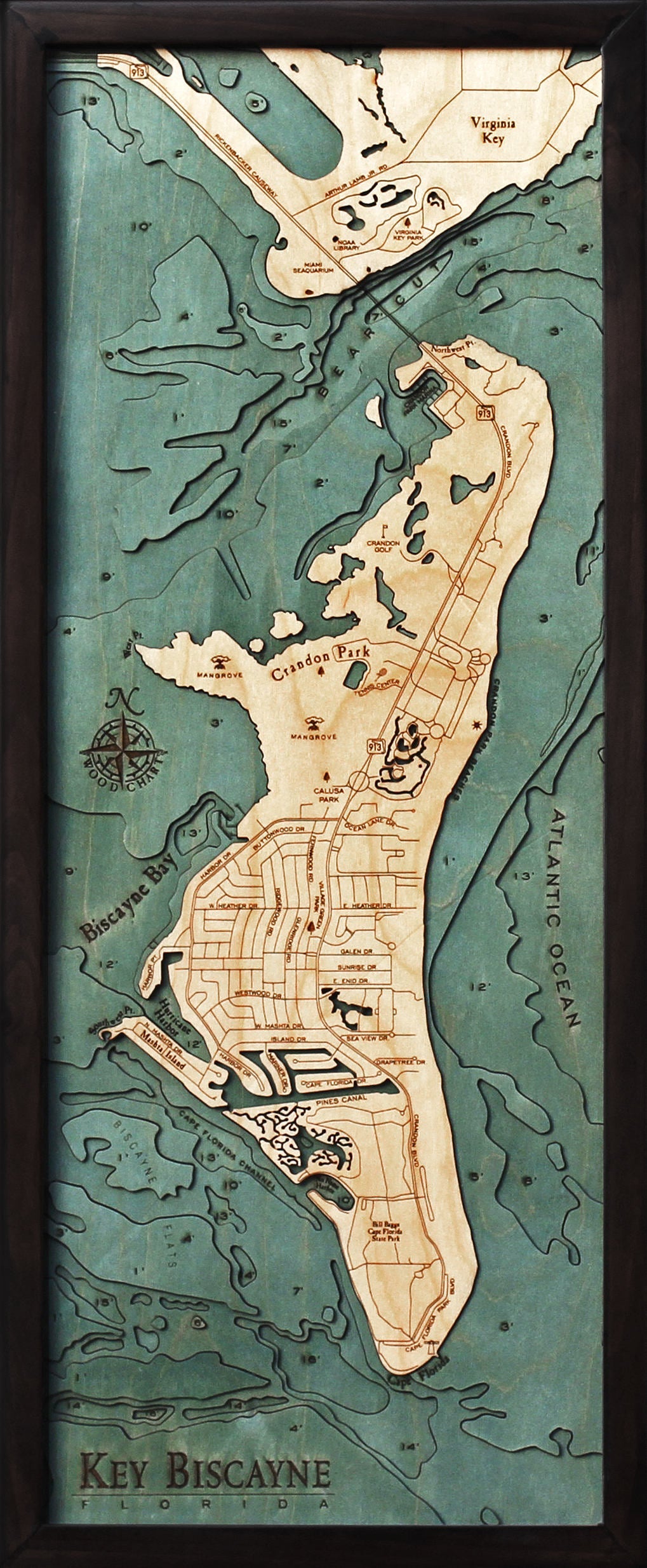 Key Biscayne, Florida 3D layered wood map in laser-cut Baltic birch, shown framed against a light wall