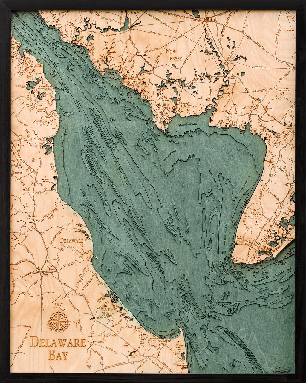 Delaware Bay 3D layered wood map in laser-cut Baltic birch, shown framed against a light wall