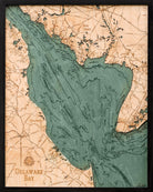 Delaware Bay 3D layered wood map in laser-cut Baltic birch, shown framed against a light wall