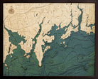 Darien, Connecticut 3D layered wood map in laser-cut Baltic birch, shown framed against a light wall