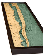 Jupiter Island, Florida 3D layered wood map in laser-cut Baltic birch, shown framed against a light wall