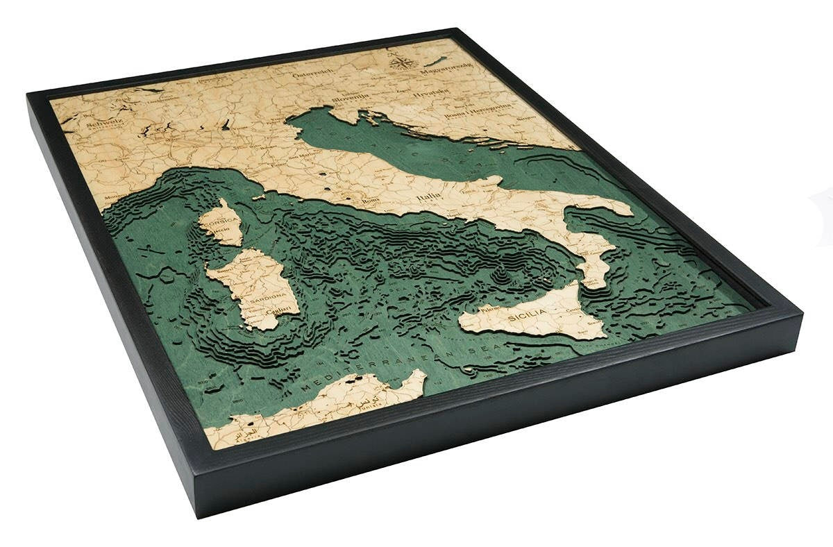Italy 3D layered wood map in laser-cut Baltic birch, shown framed against a light wall