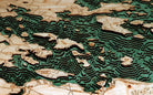 Lake Winnipesaukee, New Hampshire 3D layered wood map in laser-cut Baltic birch, shown framed against a light wall