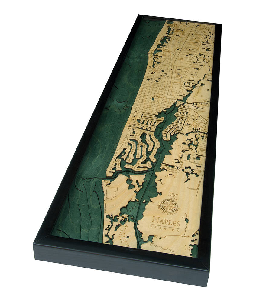 Naples, Florida 3D layered wood map in laser-cut Baltic birch, shown framed against a light wall