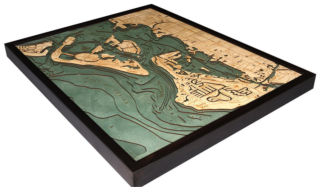 Siesta Key, Florida 3D layered wood map in laser-cut Baltic birch, shown framed against a light wall