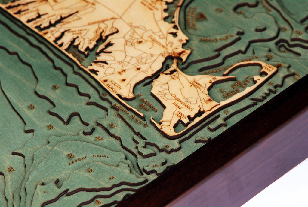 Cape Cod, Massachusetts 3D layered wood map in laser-cut Baltic birch, shown framed against a light wall