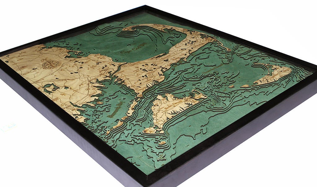 Cape Cod, Massachusetts 3D layered wood map in laser-cut Baltic birch, shown framed against a light wall