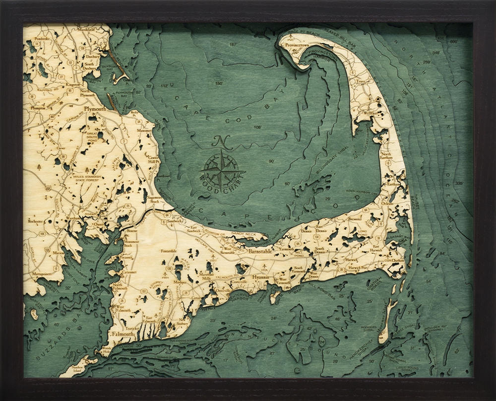 Cape Cod, Massachusetts 3D layered wood map in laser-cut Baltic birch, shown framed against a light wall