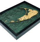 Nantucket, Massachusetts 3D layered wood map in laser-cut Baltic birch, shown framed against a light wall