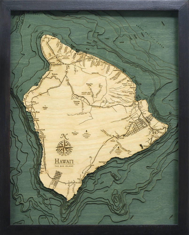 The Big Island, Hawaii 3D layered wood map in laser-cut Baltic birch, shown framed against a light wall