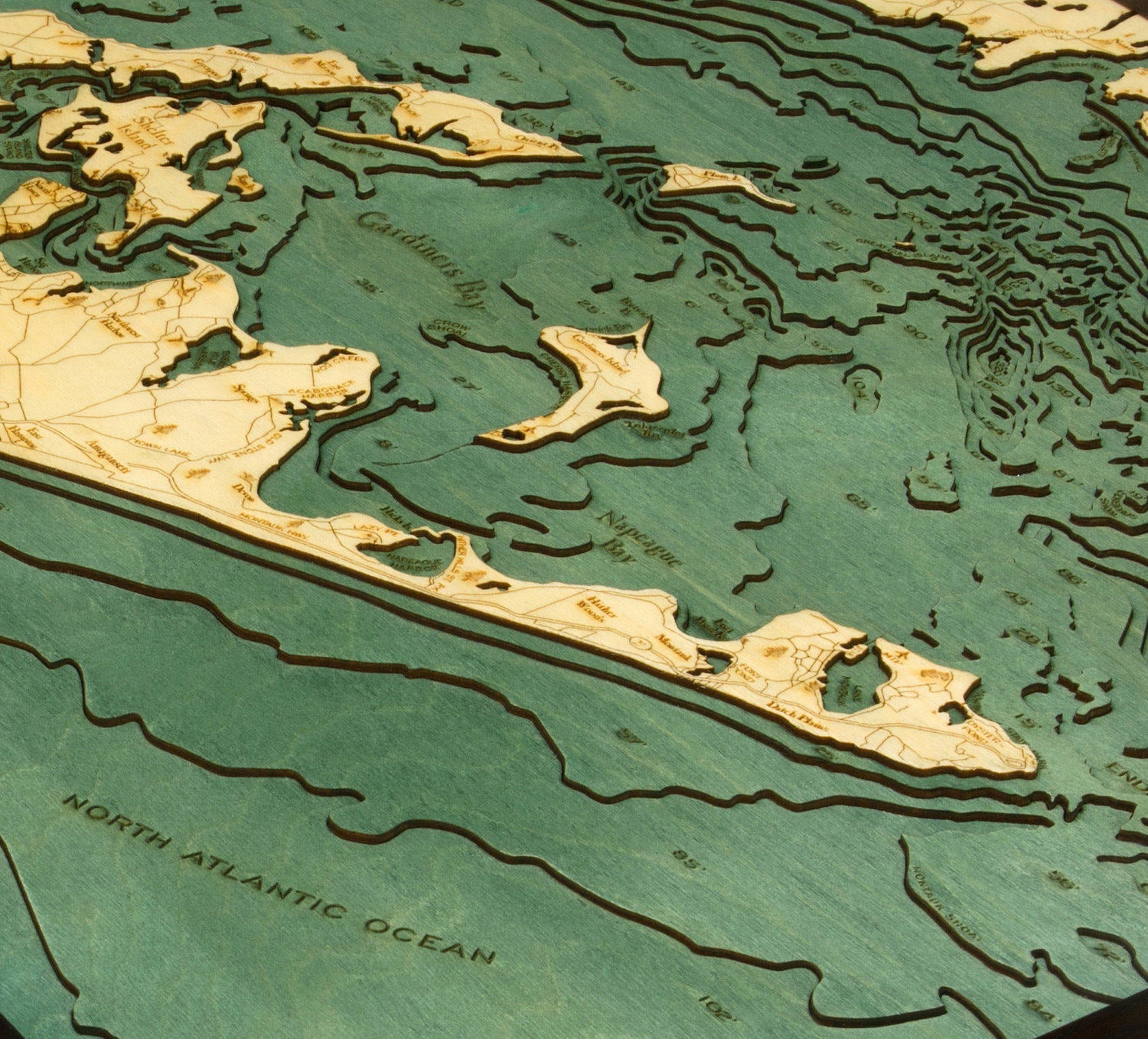 East Long Island Sound 3D layered wood map in laser-cut Baltic birch, shown framed against a light wall