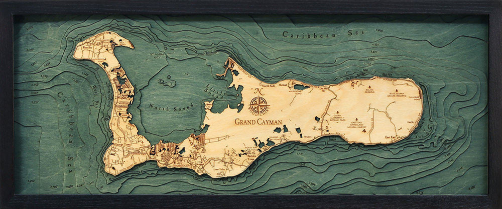 Grand Cayman, Caribbean 3D layered wood map in laser-cut Baltic birch, shown framed against a light wall