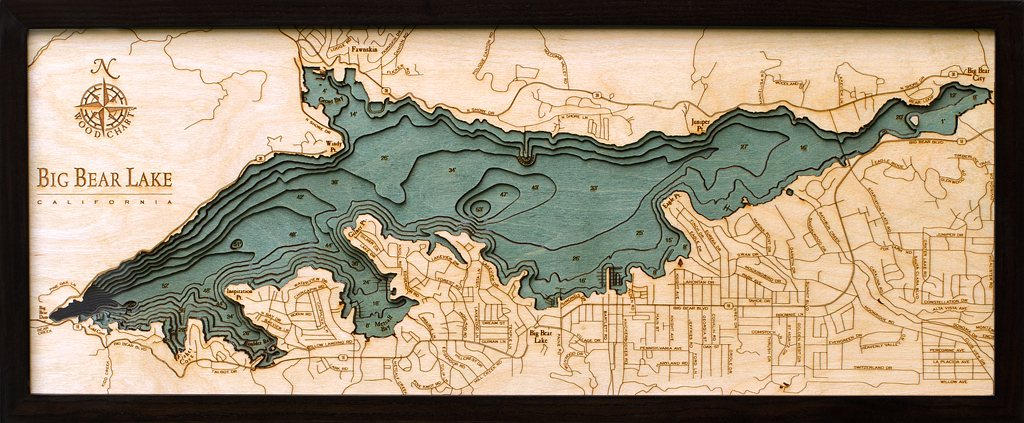 Big Bear Lake, California 3D layered wood map in laser-cut Baltic birch, shown framed against a light wall