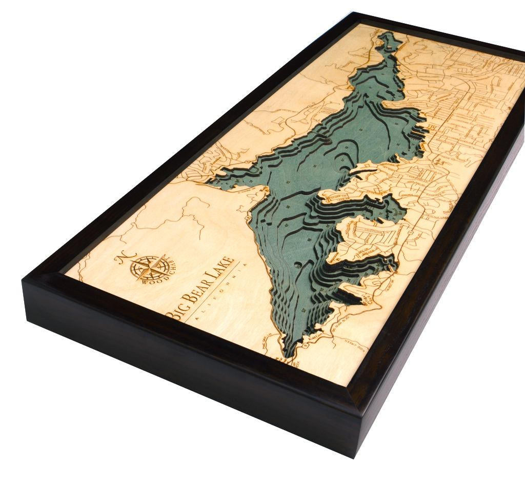 Big Bear Lake, California 3D layered wood map in laser-cut Baltic birch, shown framed against a light wall