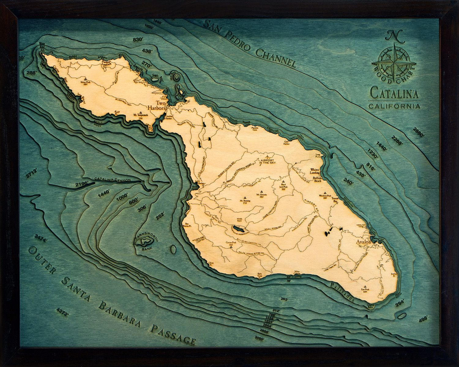 Catalina Island, California 3D layered wood map in laser-cut Baltic birch, shown framed against a light wall
