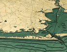 Houston, Texas 3D layered wood map in laser-cut Baltic birch, shown framed against a light wall
