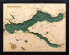 Lake Charlevoix, Michigan 3D layered wood map in laser-cut Baltic birch, shown framed against a light wall