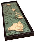 Hawaiian Islands 3D layered wood map in laser-cut Baltic birch, shown framed against a light wall
