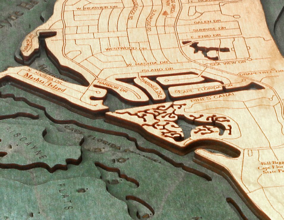 Key Biscayne, Florida 3D layered wood map in laser-cut Baltic birch, shown framed against a light wall