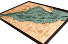 Delaware Bay 3D layered wood map in laser-cut Baltic birch, shown framed against a light wall