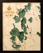 Arbutus (Traverse), Michigan 3D layered wood map in laser-cut Baltic birch, shown framed against a light wall